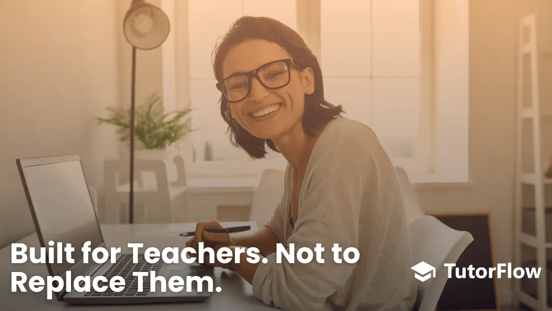Smiling teacher sitting on a desk
